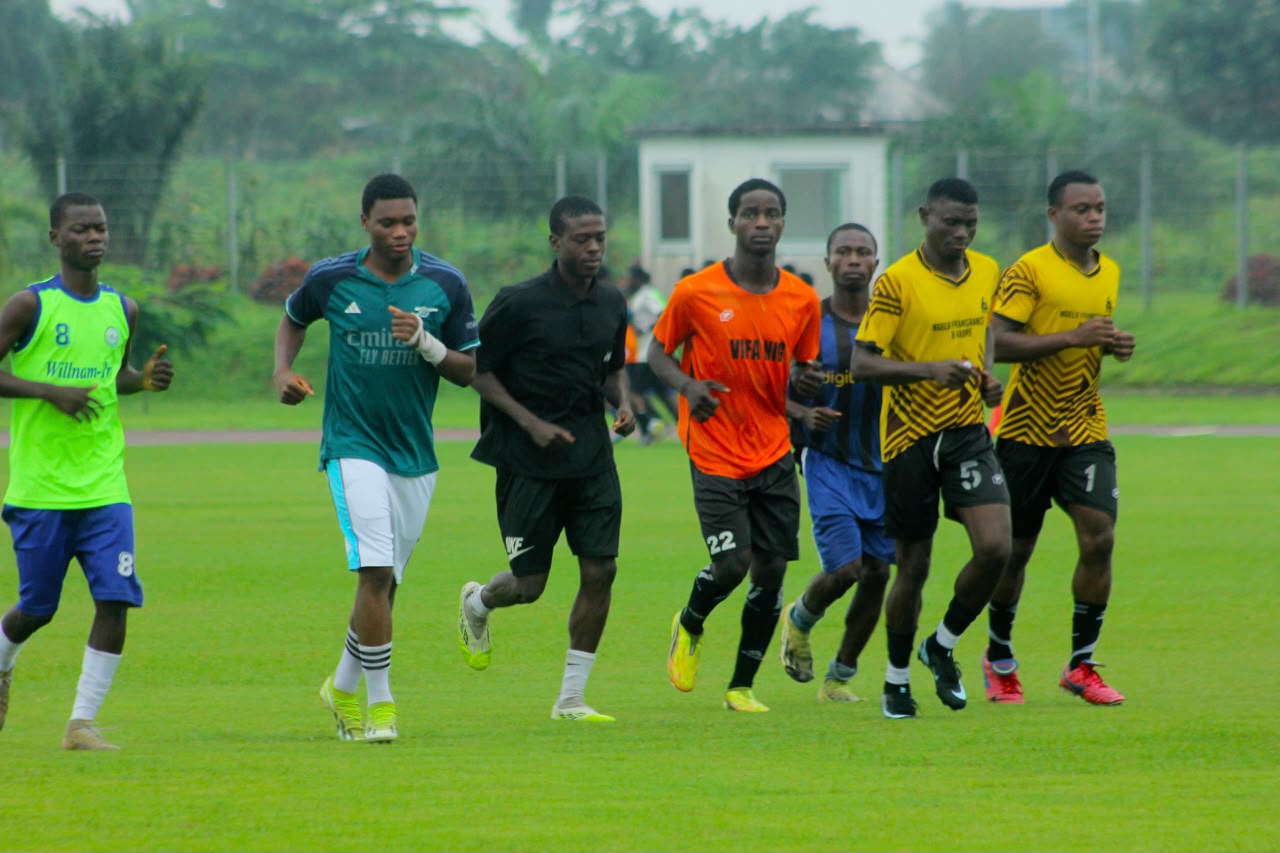 Camp Gee Football Academy players running together during a conditioning session in Uyo